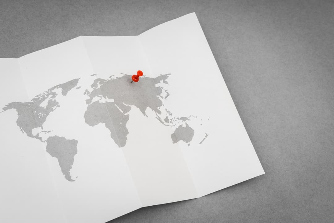 flat lay map with a pin - Image by jannoon028 on Freepik